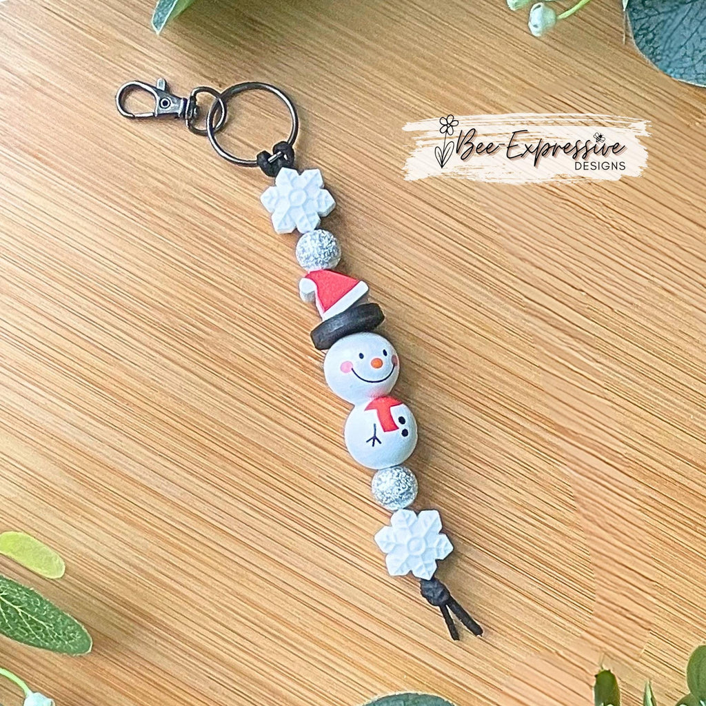 Adorable, handmade, Christmas WOOD snowman keychain! Lobster swivel clasp, keyring, suede cord, printed wood beads, silicone snowflake beads
