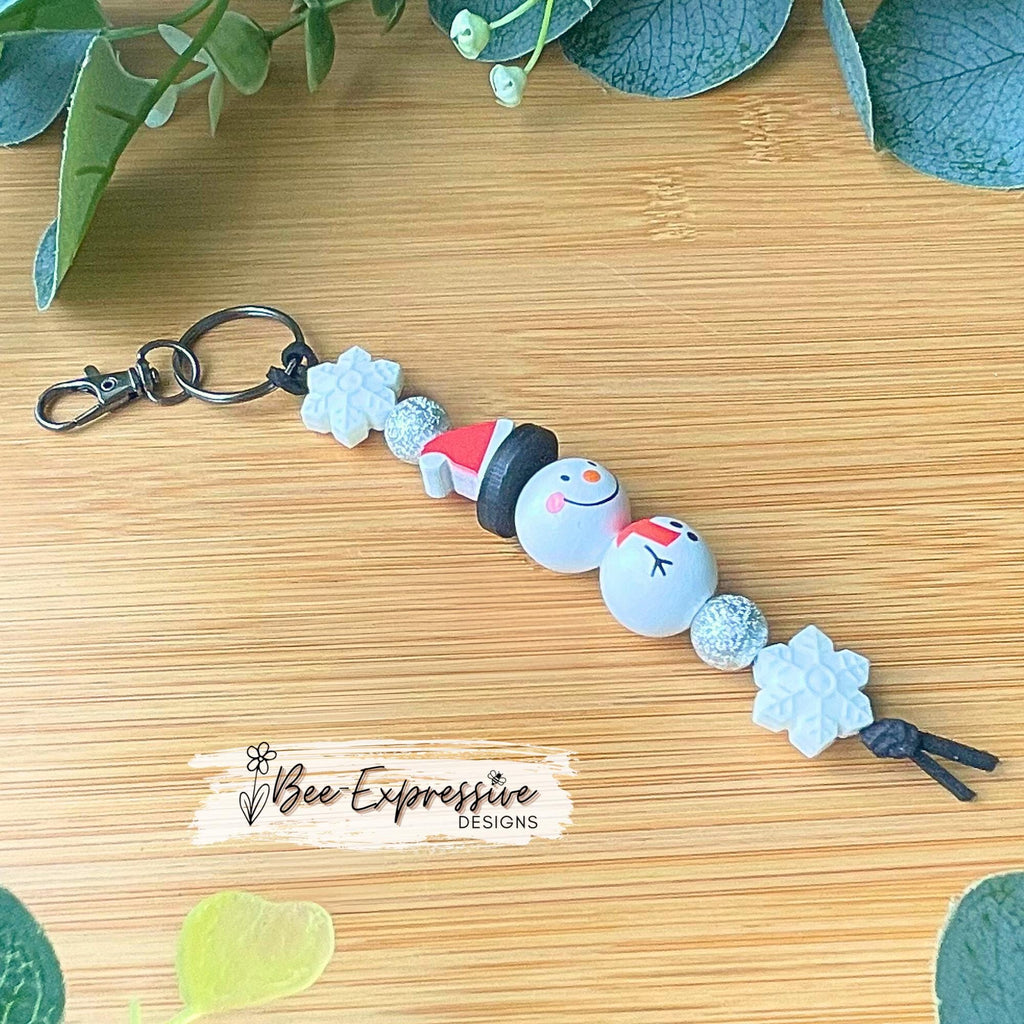 Adorable, handmade, Christmas WOOD snowman keychain! Lobster swivel clasp, keyring, suede cord, printed wood beads, silicone snowflake beads