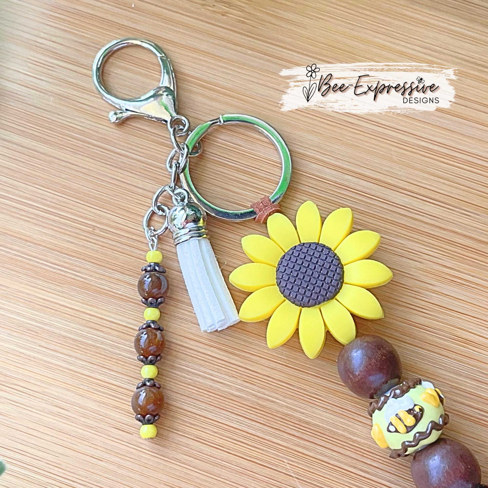 Beautiful, beaded, handmade, silicone SUNFLOWER bee keychain! Lobster clasp, suede cord, lampwork and wood beads, beaded acrylic tassel