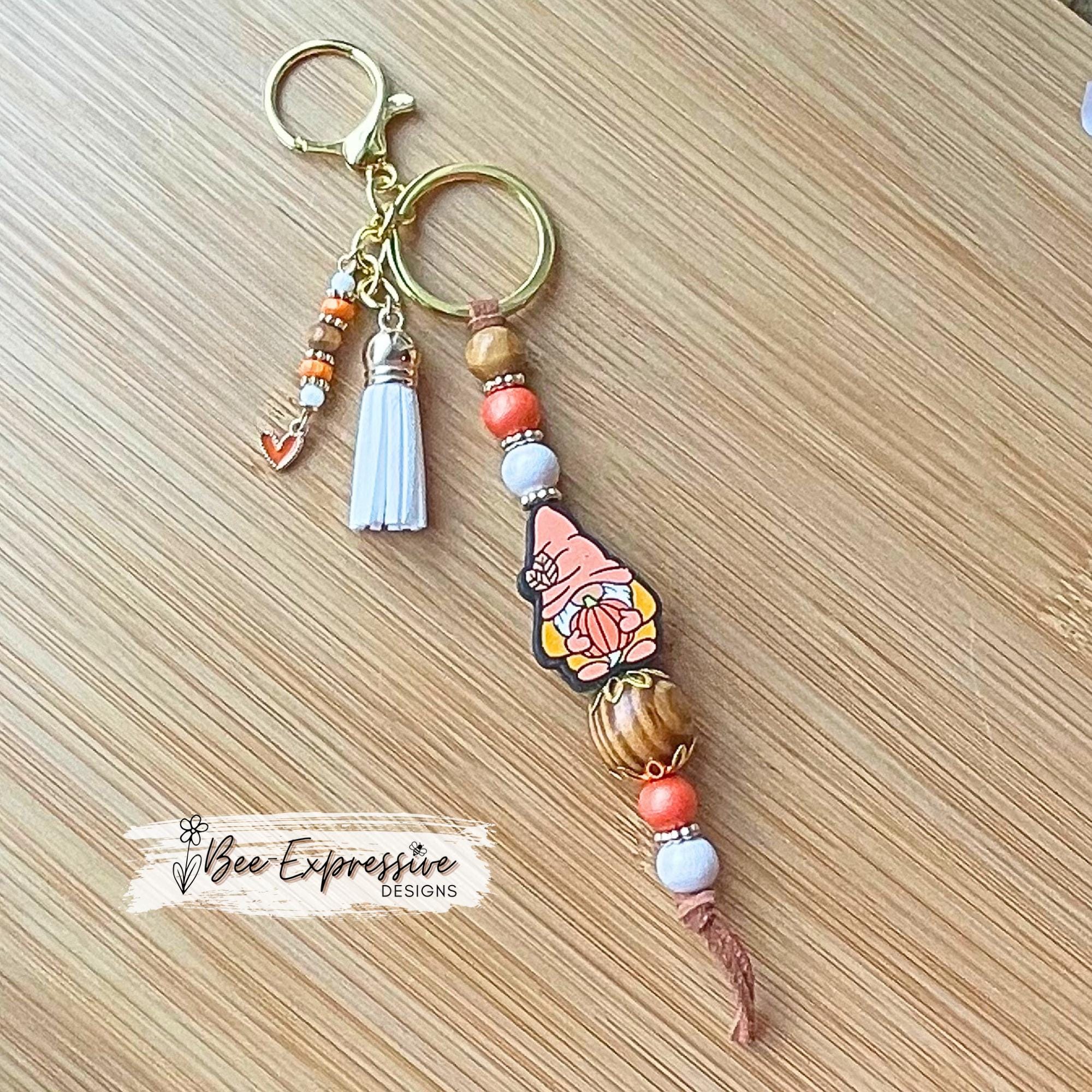 Fall GNOME keychain! Lobster or swivel clasp, suede cord, studded spacers, wood & silicone beads, pumpkin, beaded tassel with heart charm!