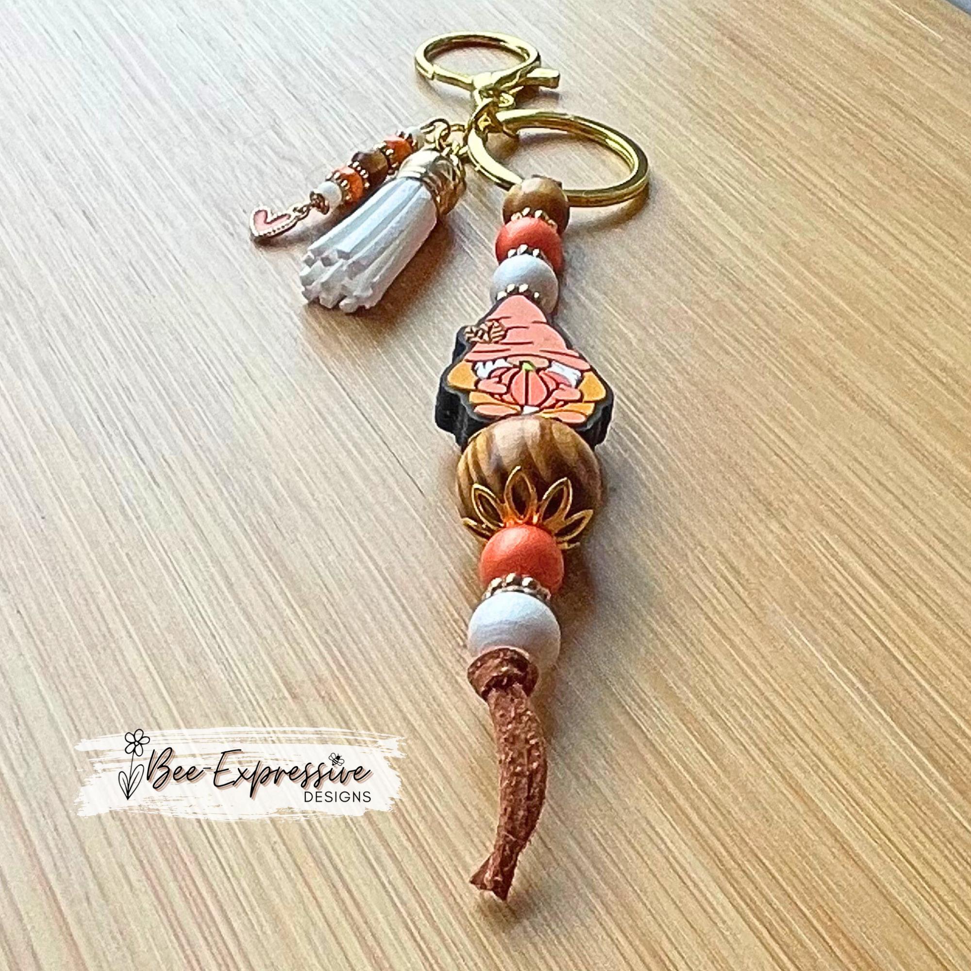 Fall GNOME keychain! Lobster or swivel clasp, suede cord, studded spacers, wood & silicone beads, pumpkin, beaded tassel with heart charm!