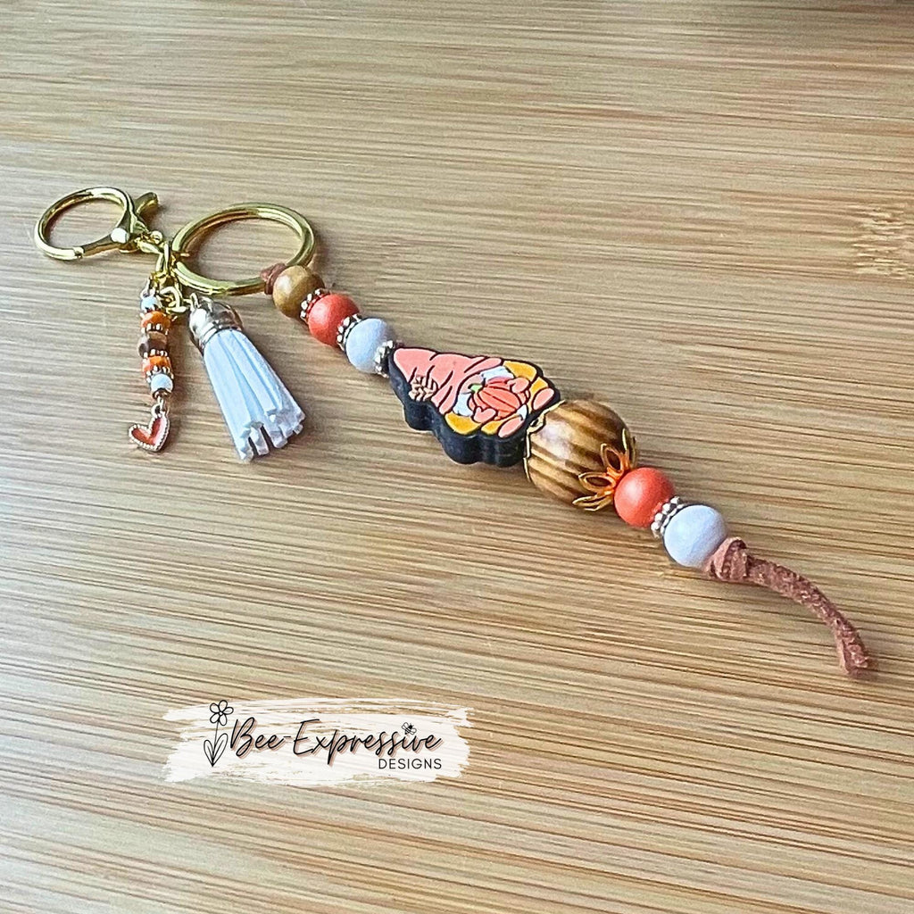 Fall GNOME keychain! Lobster or swivel clasp, suede cord, studded spacers, wood & silicone beads, pumpkin, beaded tassel with heart charm!