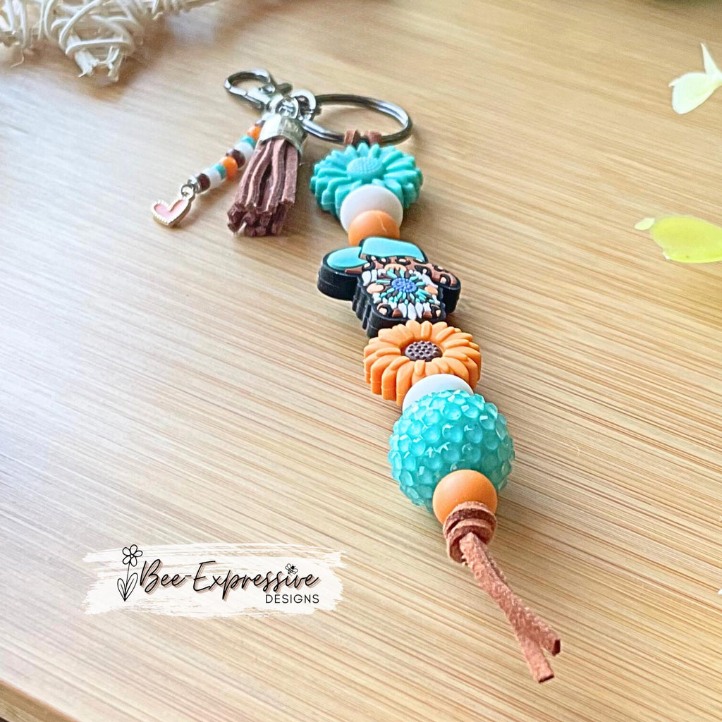 Handmade, unique, western GNOME keychain! Swivel clasp, suede cord, lentil beads, chunky bead, focal bead, beaded tassel with heart charm!