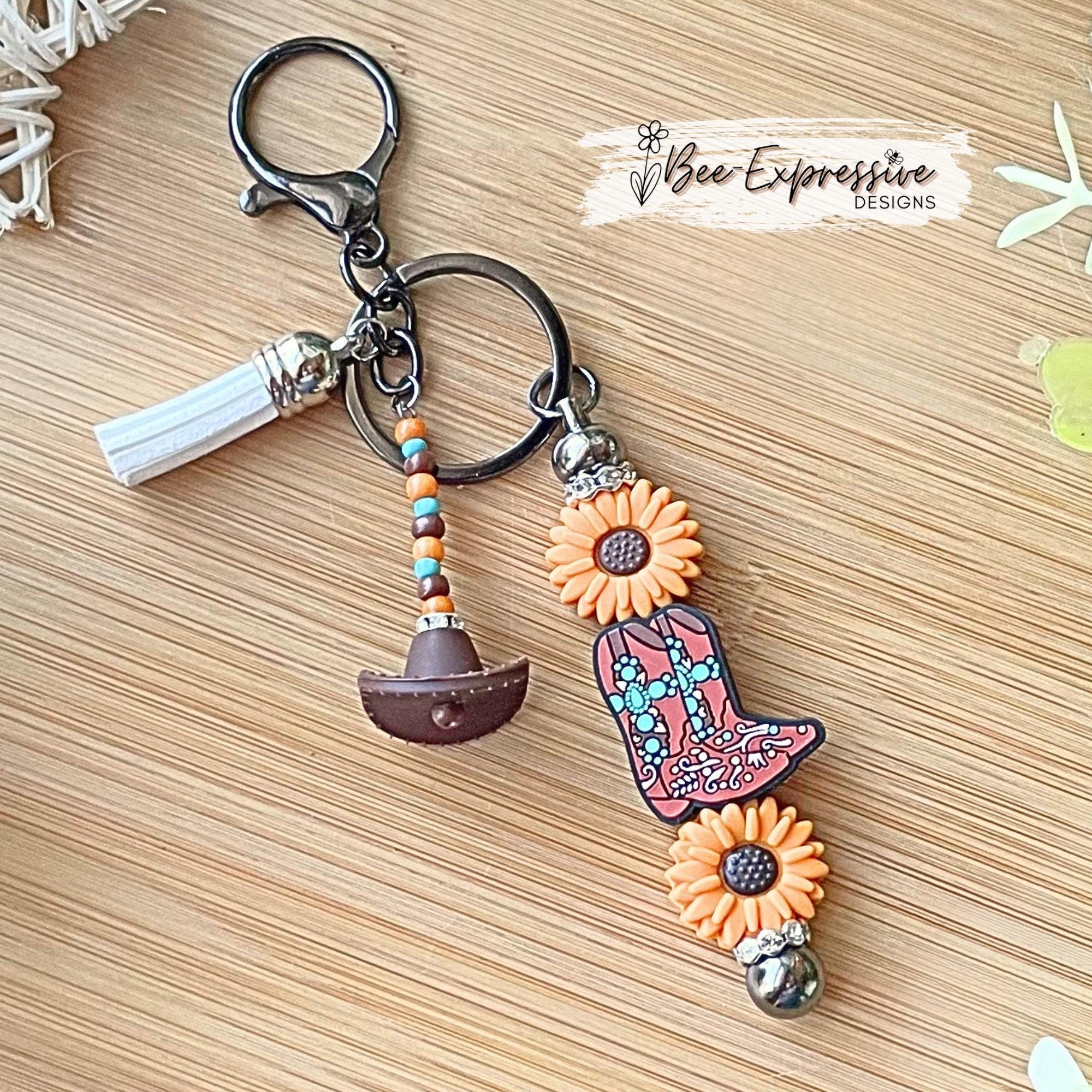 Handmade, beaded, BOOT & SUNFLOWER metal keychain!  Lobster clasp, acrylic beaded tassel, silicone western hat, cowboy, cowgirl, flowers!