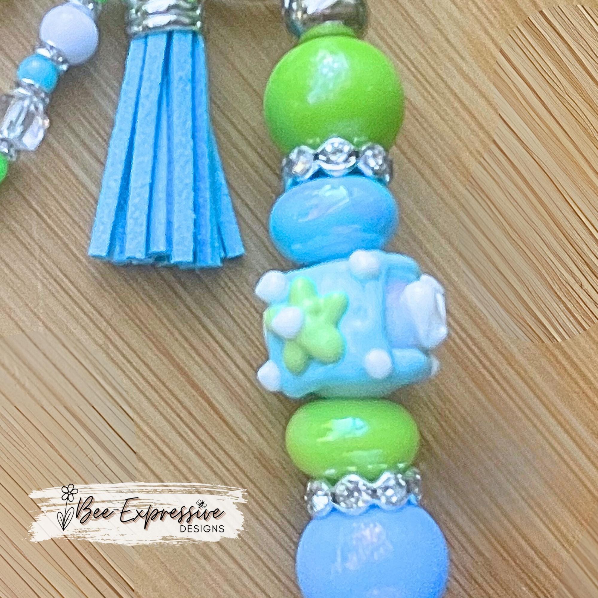 Beautiful, handmade iridescent keychain! Lobster clasp, keyring, bar, lampwork bead, rhinestone spacers, acrylic, beaded tassel, heart charm