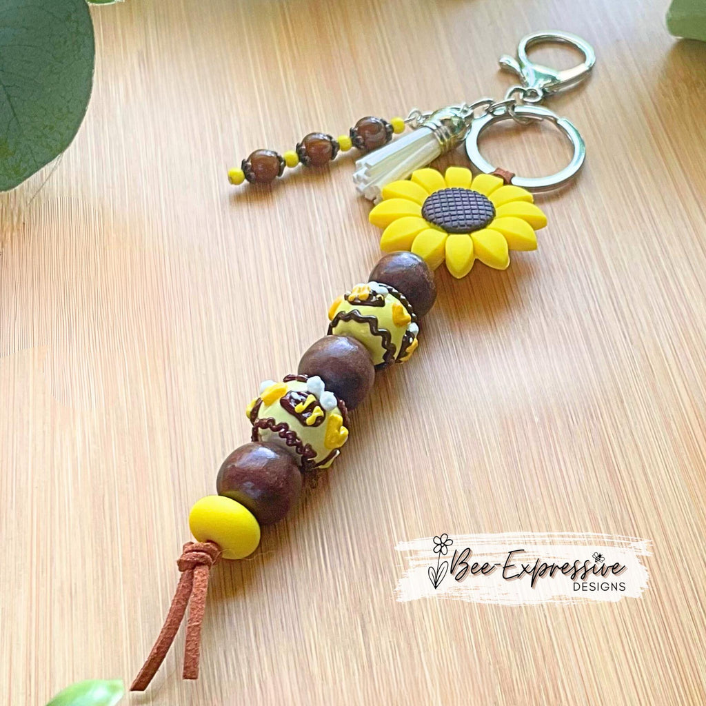 Beautiful, beaded, handmade, silicone SUNFLOWER bee keychain! Lobster clasp, suede cord, lampwork and wood beads, beaded acrylic tassel