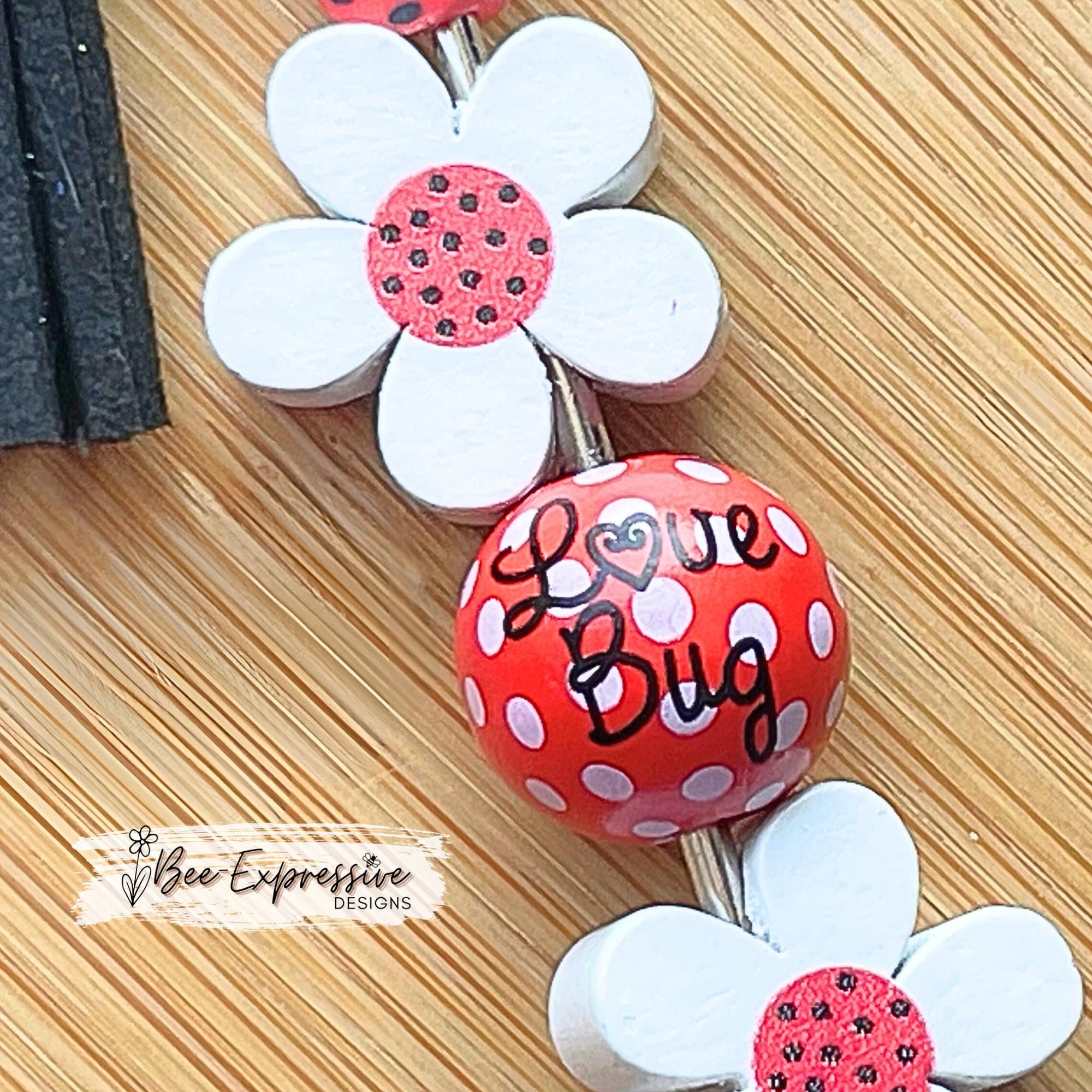 Handmade, beaded, lady bug keychain! Lobster or swivel clasp, wood daisy flowers, polka dot bead, and a beaded tassel with a lady bug charm