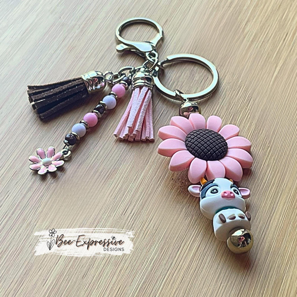 Handmade, silicone 3D COW & pink SUNFLOWER bead keychain! Lobster clasp, bead bar, acrylic beads, beaded tassel with pink daisy charm!
