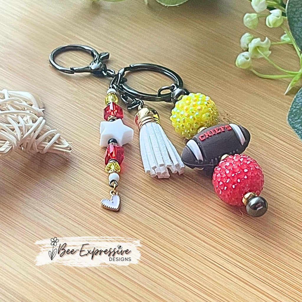 Handmade, FOOTBALL beaded keychain! Silicone football bead says CHIEFS, acrylic chunky beads, gold spacers, beaded tassel, star, heart charm