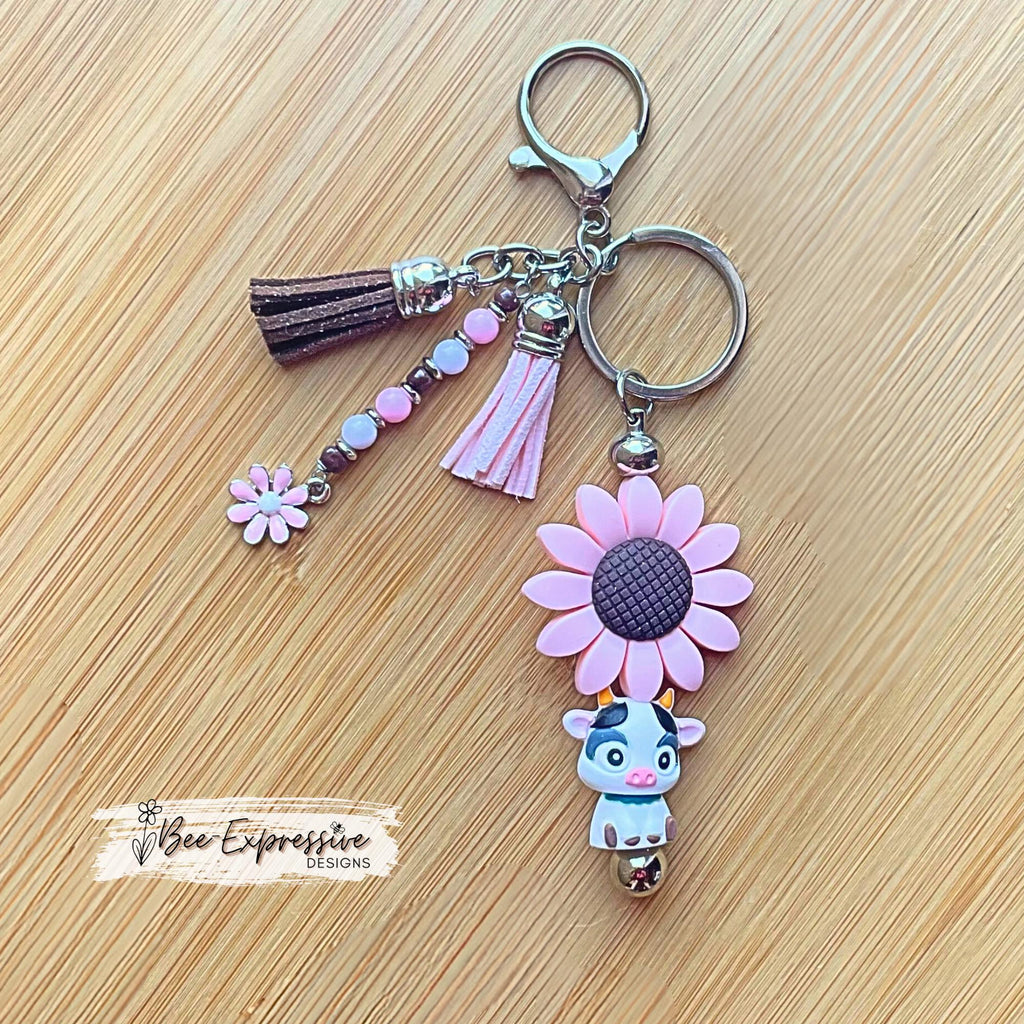 Handmade, silicone 3D COW & pink SUNFLOWER bead keychain! Lobster clasp, bead bar, acrylic beads, beaded tassel with pink daisy charm!