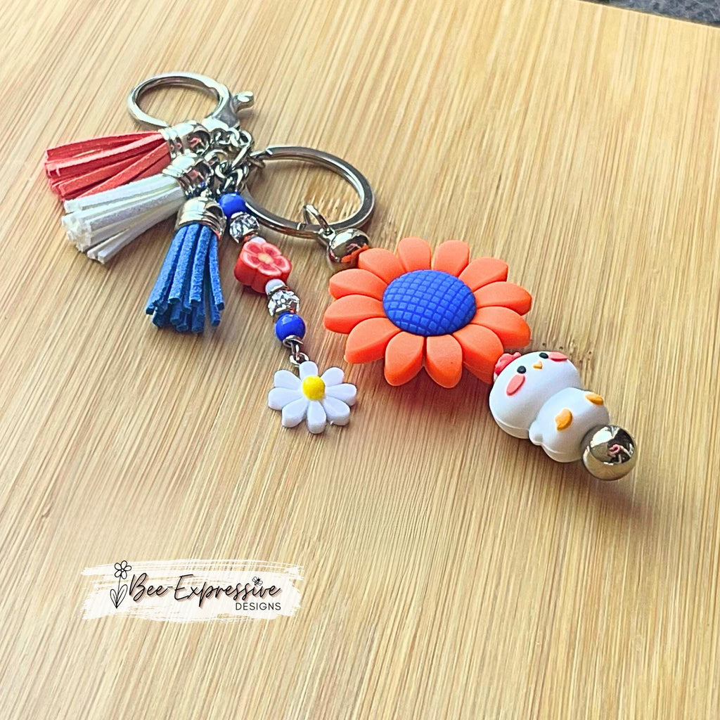 Handmade, silicone CHICKEN and DAISY flower keychain! Lobster or swivel clasp, bead bar, beaded tassel with a white daisy charm, 3 tassels