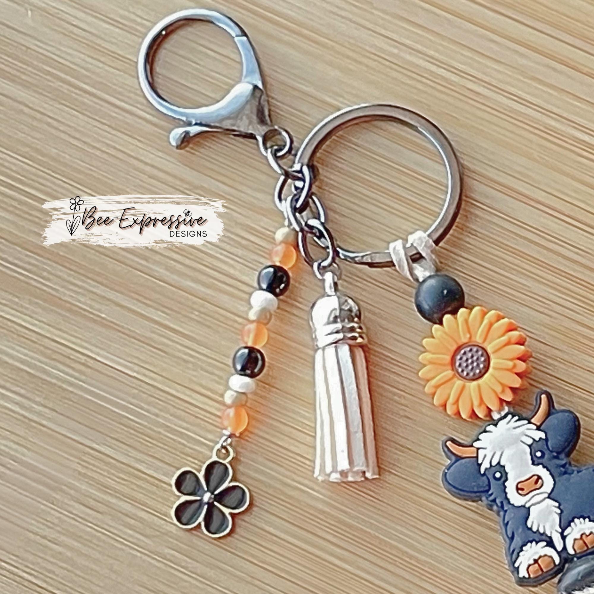 HANDMADE, bull COW keychain! Lobster or swivel clasp, cord, silicone sunflower bead, furry beads, beaded tassel with black flower charm!