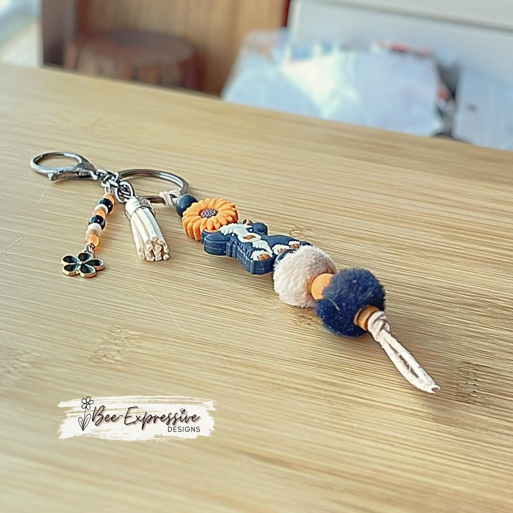 HANDMADE, bull COW keychain! Lobster or swivel clasp, cord, silicone sunflower bead, furry beads, beaded tassel with black flower charm!
