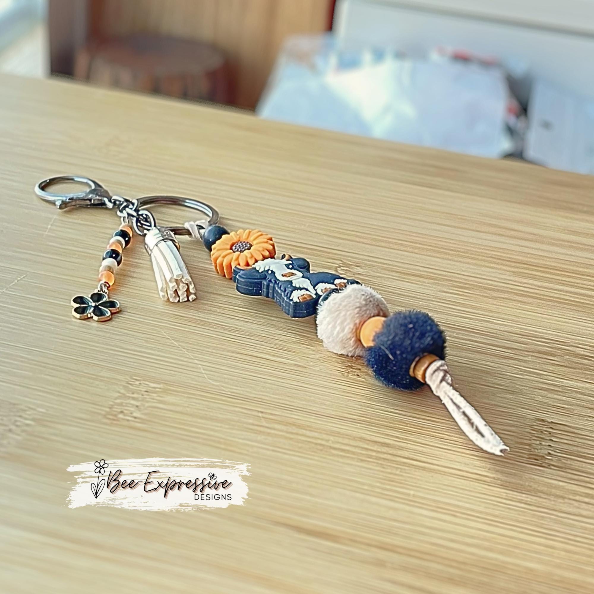 HANDMADE, bull COW keychain! Lobster or swivel clasp, cord, silicone sunflower bead, furry beads, beaded tassel with black flower charm!