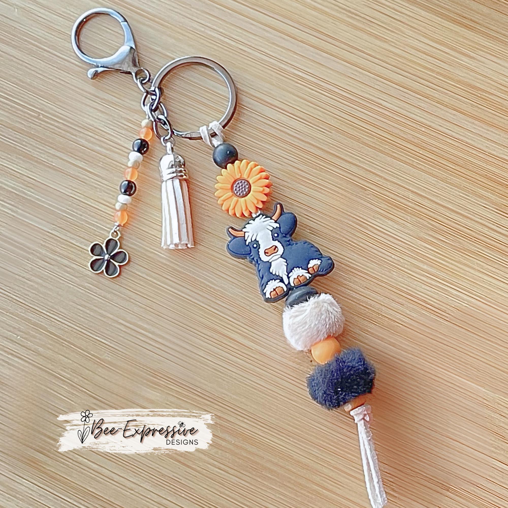 Handmade Cow Keychain: Beaded Tassel, Sunflower Accent