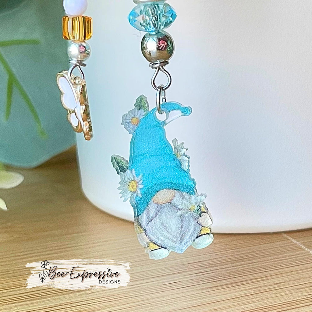 Acrylic gnome charm and silicone daisy flower, tumbler charm chain! Beaded tassel with transparent beads and white butterfly charm pendant!