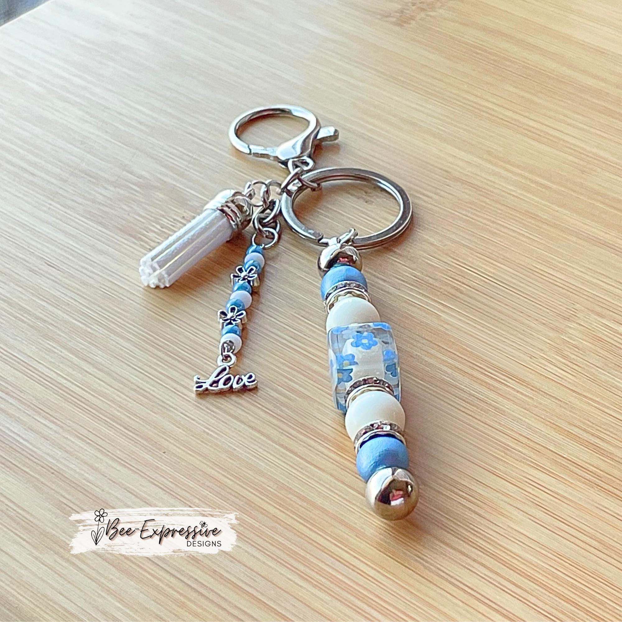 Beaded, baby blue & white, keychain! Lobster or swivel clasp, wood and acrylic beads, beaded tassel with silver flowers and a LOVE charm