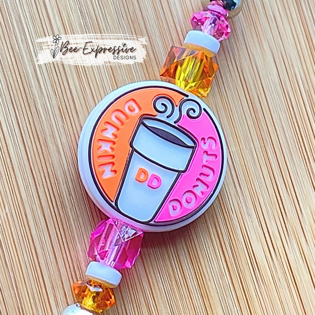 Unique, beaded, DD donut badge reel!  Metal clip and pull cable, silicone donut appliqué, a beaded bar with acrylic beads, spacers!
