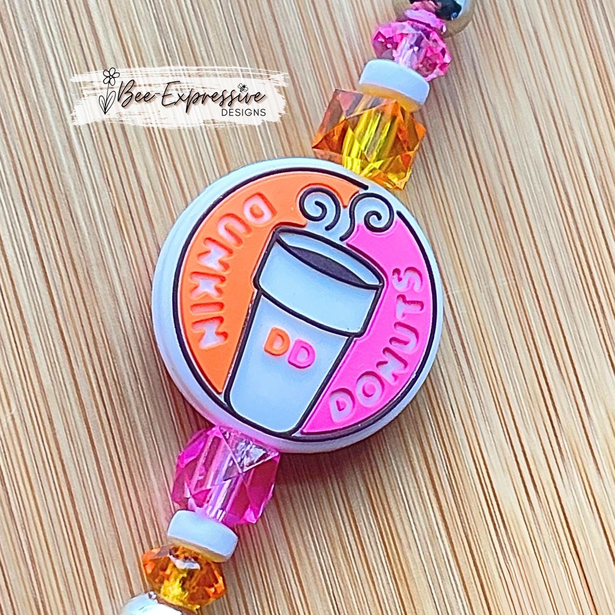 Unique, beaded, DD donut badge reel!  Metal clip and pull cable, silicone donut appliqué, a beaded bar with acrylic beads, spacers!