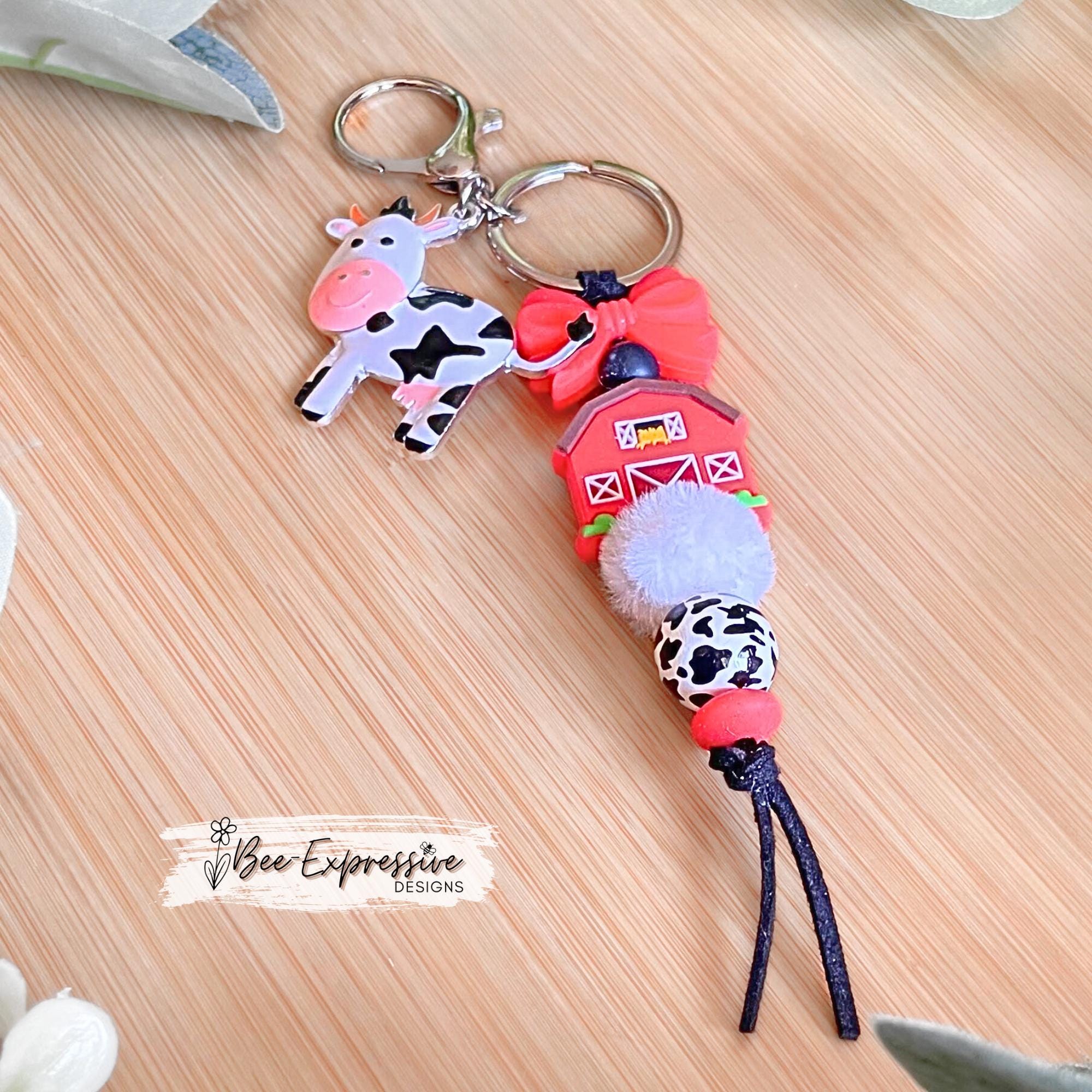 Silicone RED BARN and cow charm keychain! Lobster or swivel clasp, suede cord, silicone bow, wood animal print bead, a metal cow charm!