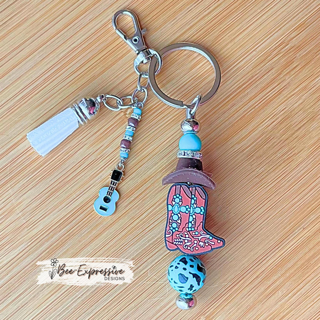 Beaded, western boots & cowboy HAT, keychain! Swivel clasp, silicone beads, animal print bead, acrylic beaded tassel with a guitar charm!