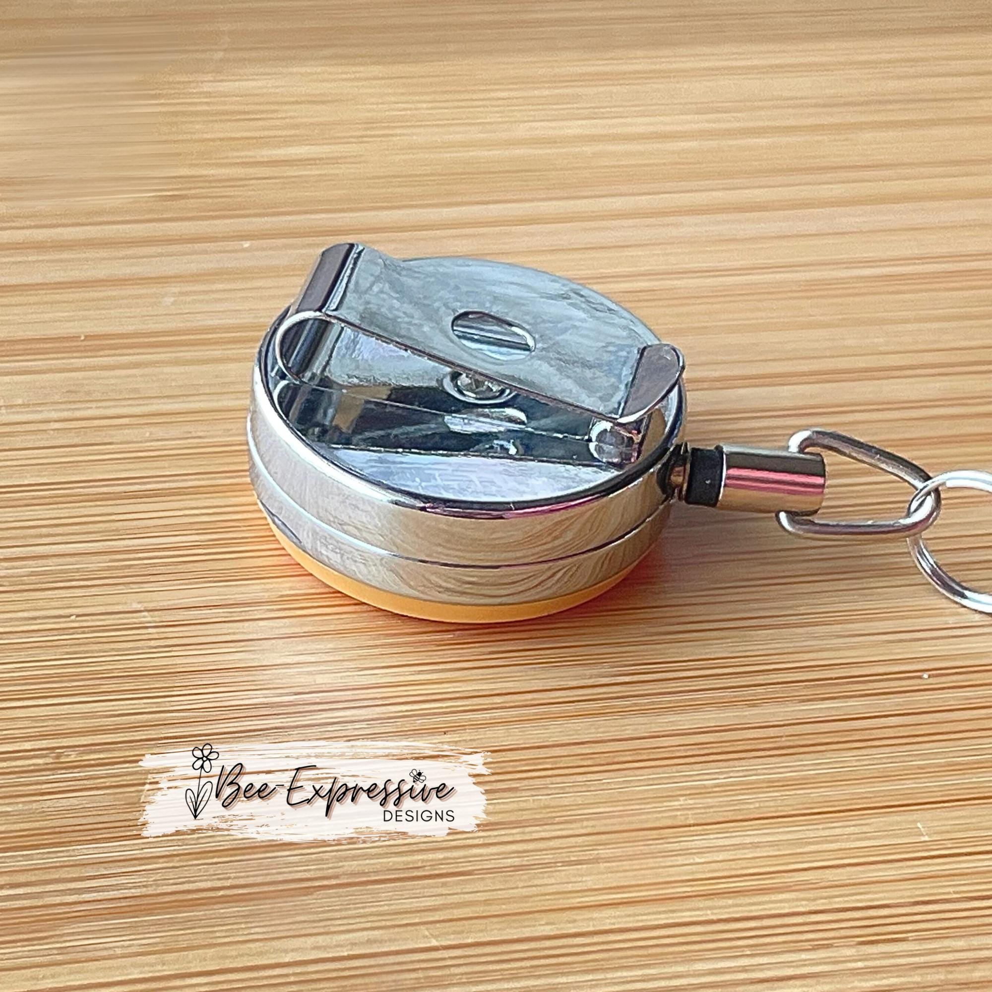 Unique, beaded, DD donut badge reel!  Metal clip and pull cable, silicone donut appliqué, a beaded bar with acrylic beads, spacers!