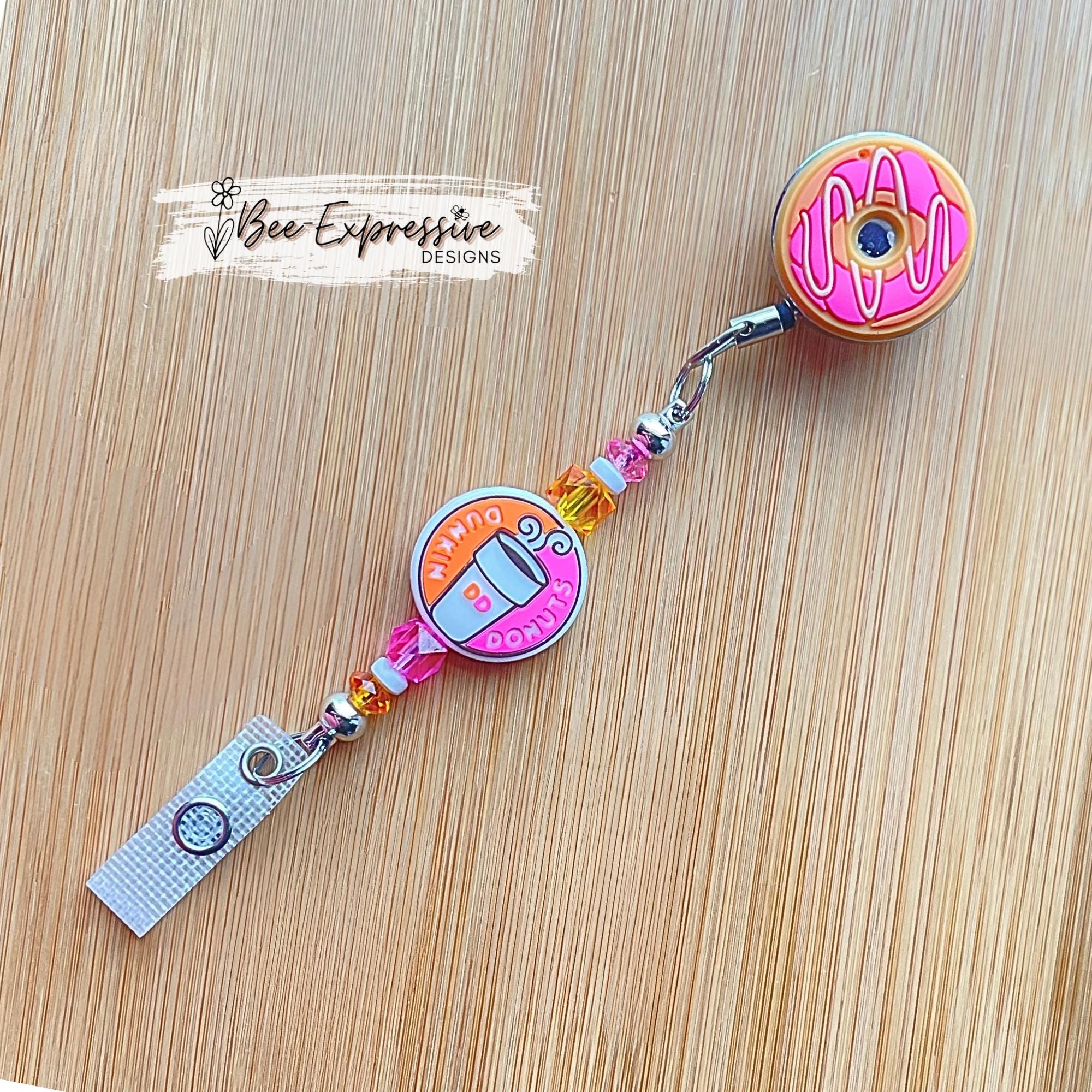 Unique, beaded, DD donut badge reel!  Metal clip and pull cable, silicone donut appliqué, a beaded bar with acrylic beads, spacers!