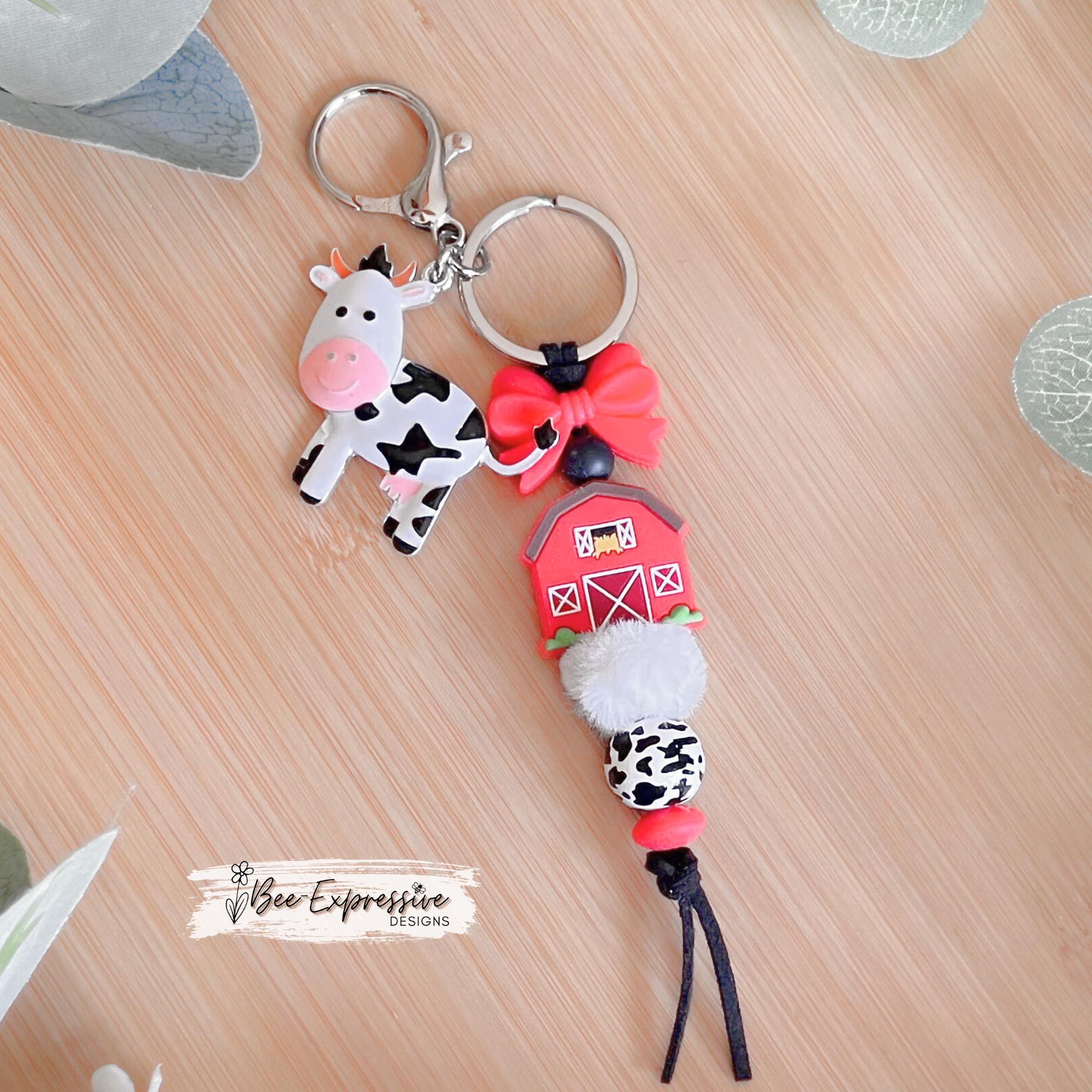 Silicone RED BARN and cow charm keychain! Lobster or swivel clasp, suede cord, silicone bow, wood animal print bead, a metal cow charm!