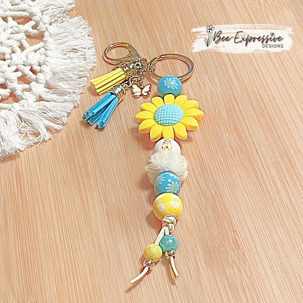 Beaded, silicone SUNFLOWER gnome keychain! Lobster or swivel clasp, suede cord, floral wood beads, furry bead, tassels, butterfly charm!