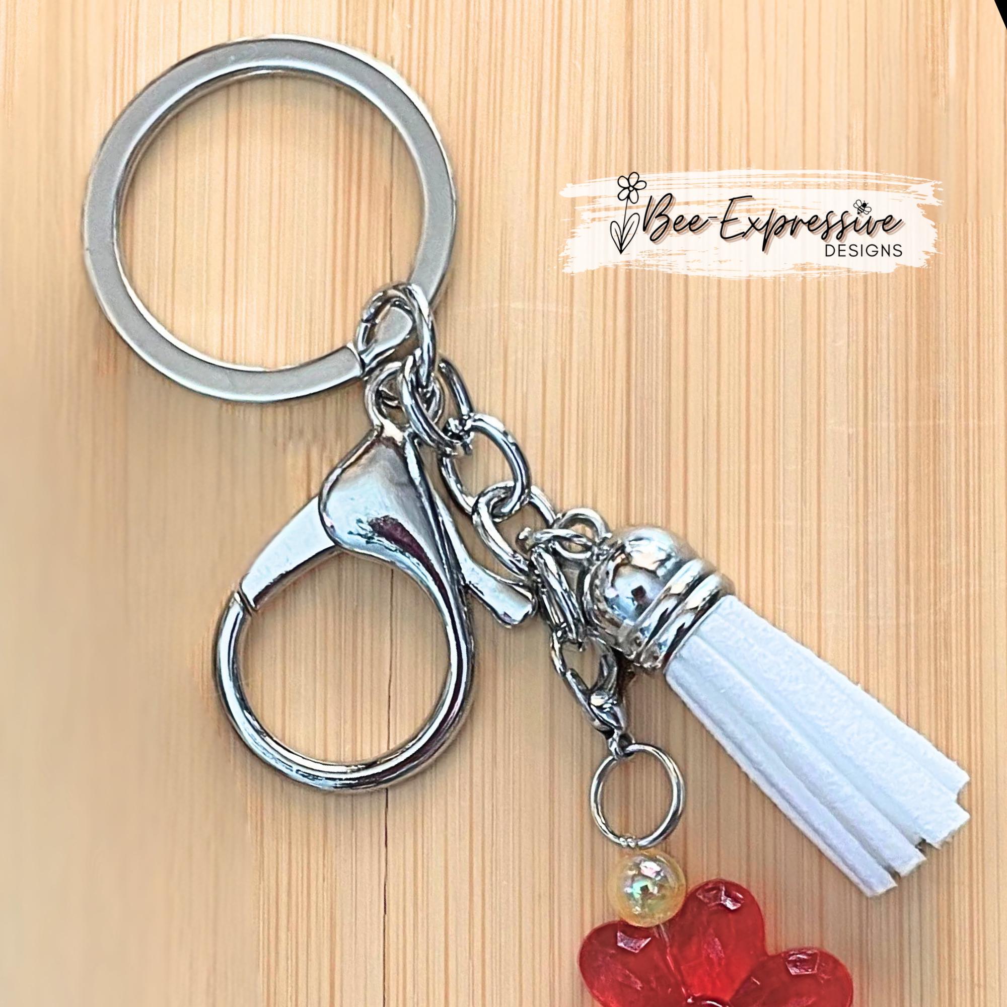 Beautiful, handmade keychain with transparent acrylic flower beads, yellow faux pearl beads, rhinestone spacers and red mushroom charm!