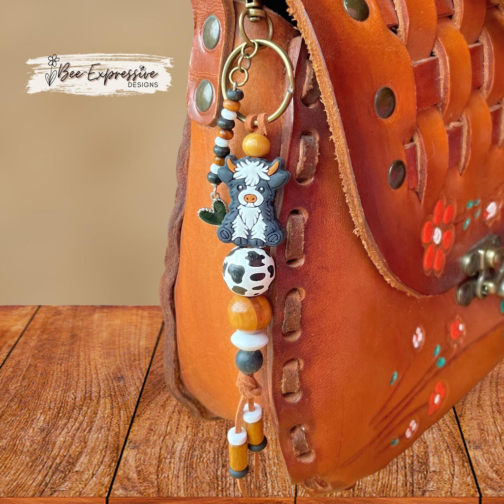 Cow keychain, bag accessory! Swivel clasp with or without a keyring, wood and silicone beads, cow print bead, beaded tassel with heart charm