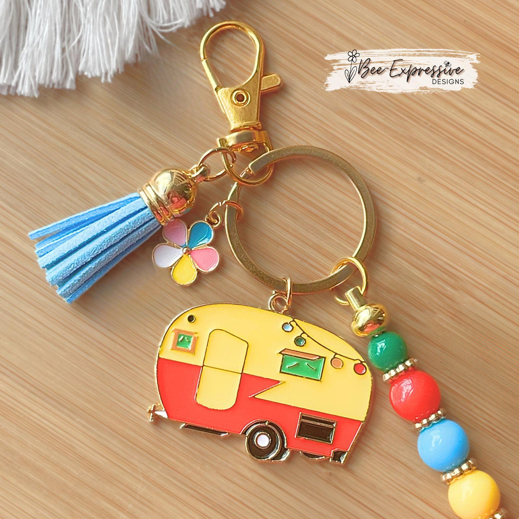 Beaded, CAMPER or RV, keychain! Swivel clasp with an keyring, acrylic beads, spacers, camper charm, multi flower charm, and a suede tassel!