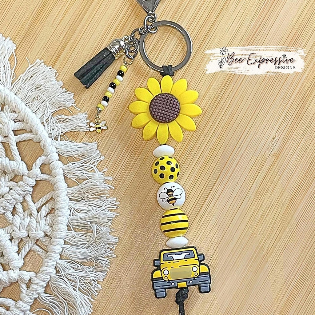 Beaded, BEE 4x4 keychain!  Lobster or swivel clasp, suede cord,  2” silicone sunflower, wood bee beads, beaded tassel with a bumblebee charm