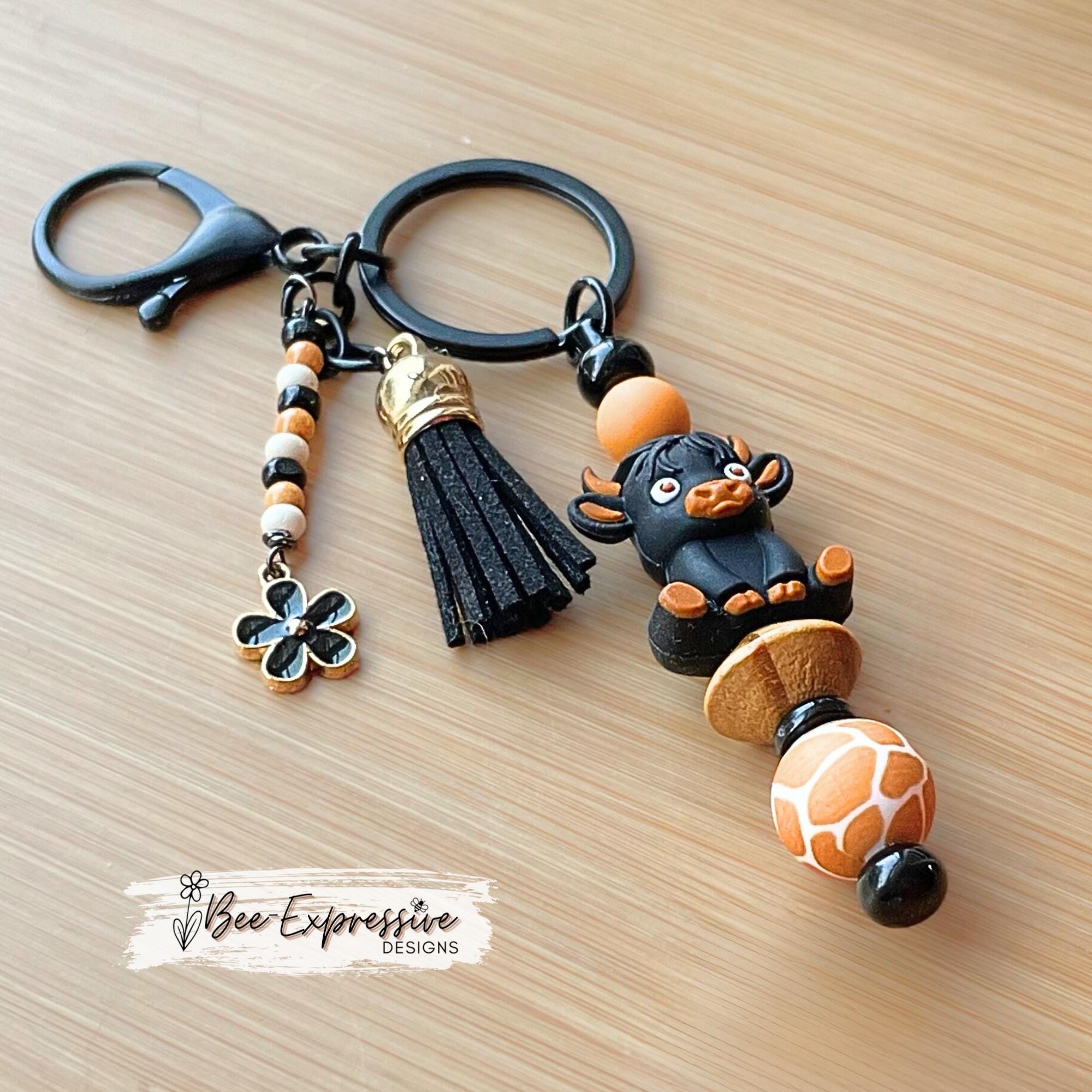 Black 3D COW, BULL, beaded keychain! Lobster clasp, bead bar, animal print bead, silicone beads, beaded tassel with black daisy charm!