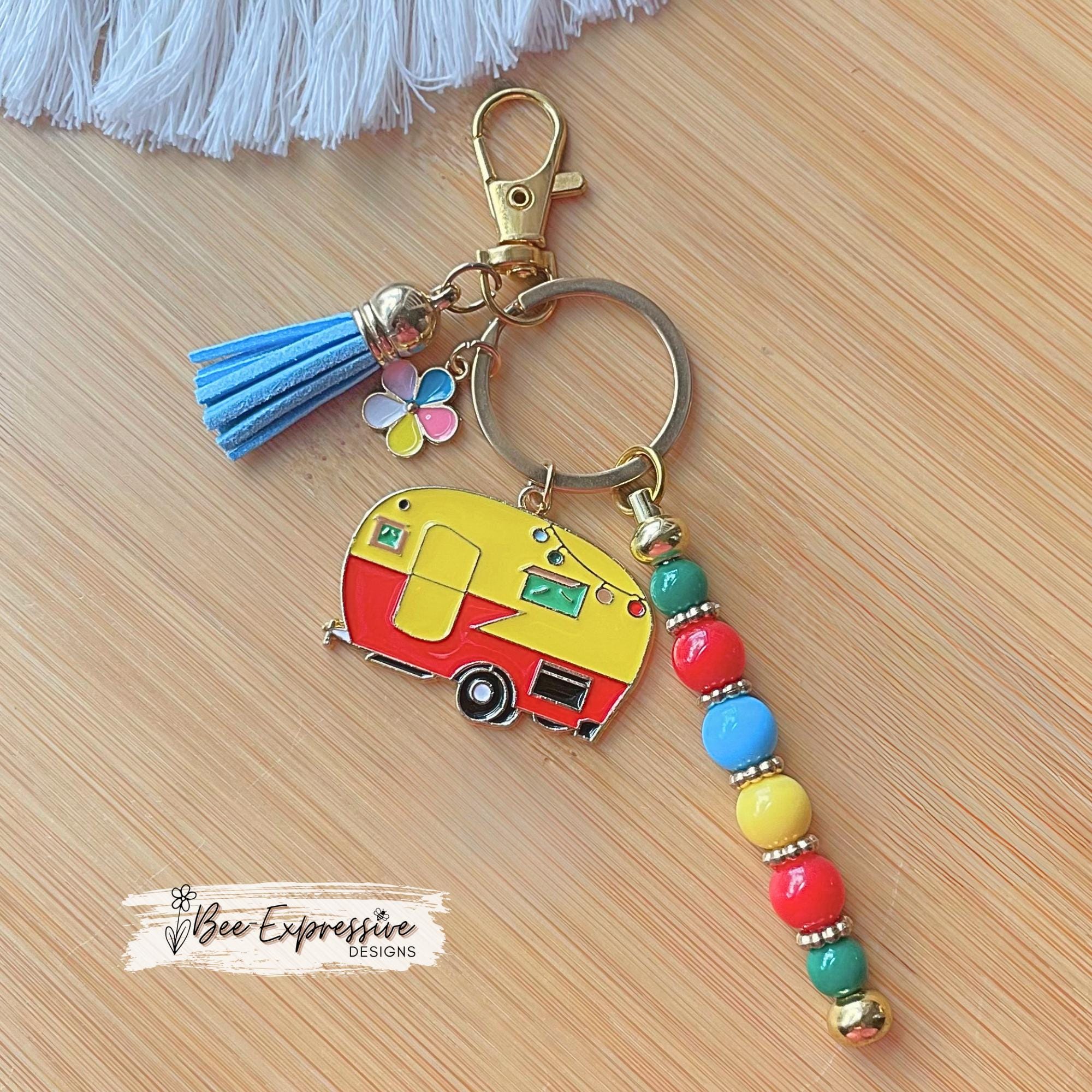 Beaded, CAMPER or RV, keychain! Swivel clasp with an keyring, acrylic beads, spacers, camper charm, multi flower charm, and a suede tassel!