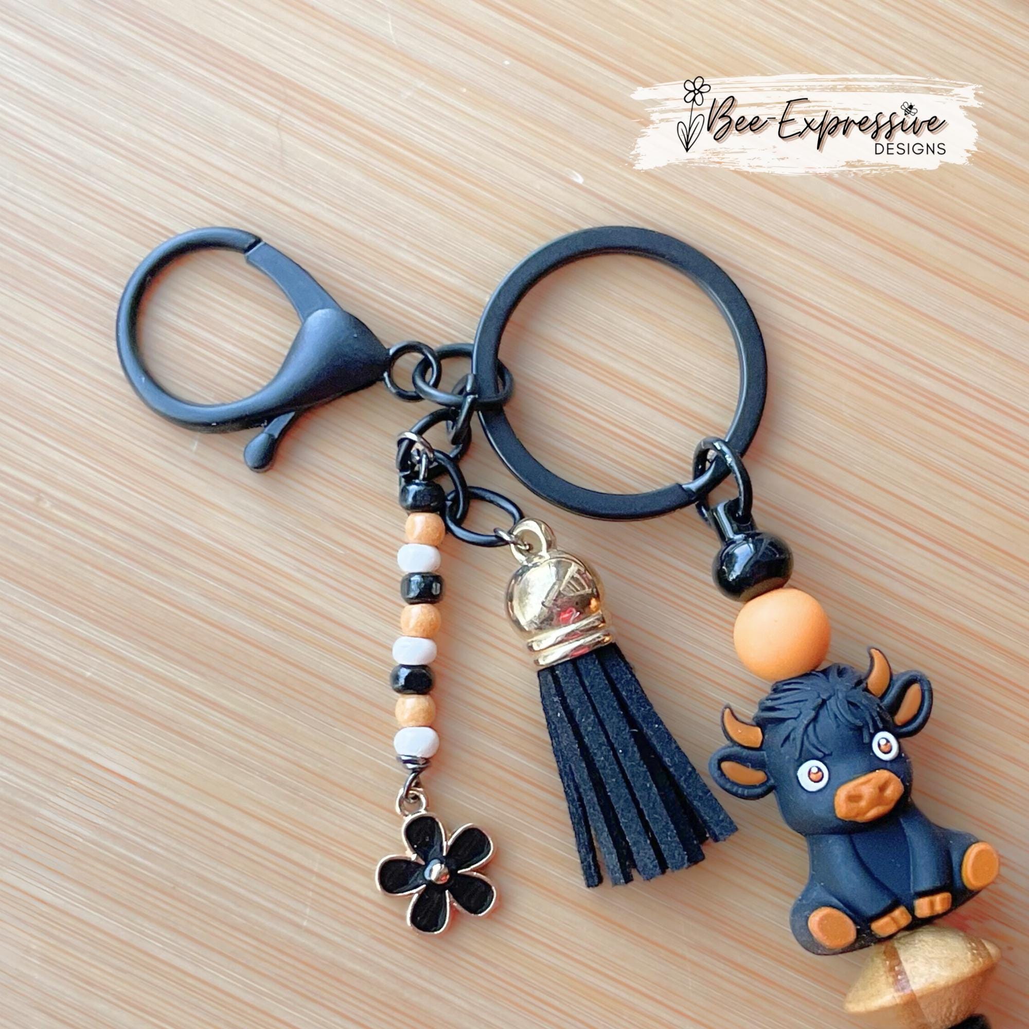Black 3D COW, BULL, beaded keychain! Lobster clasp, bead bar, animal print bead, silicone beads, beaded tassel with black daisy charm!