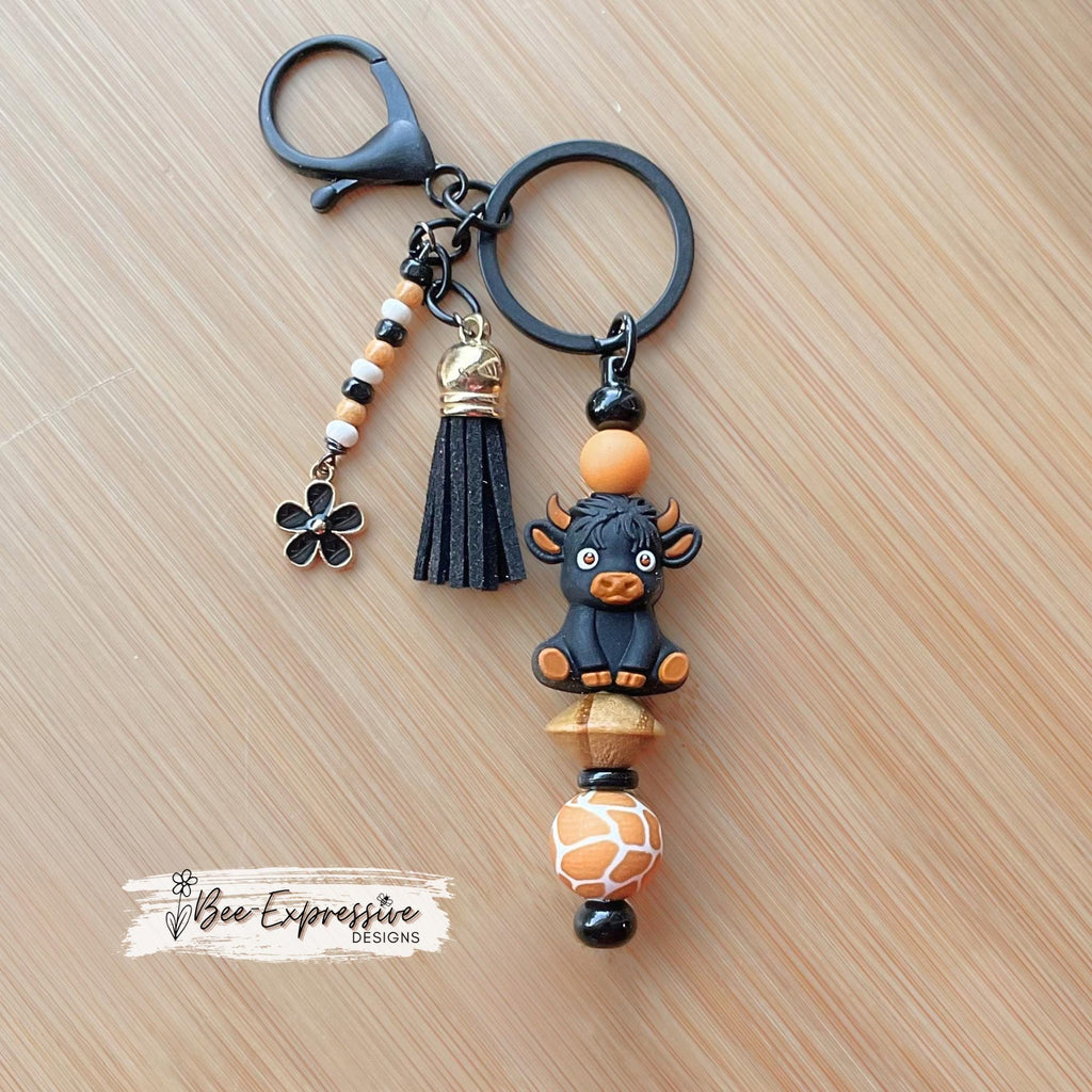 Black 3D COW, BULL, beaded keychain! Lobster clasp, bead bar, animal print bead, silicone beads, beaded tassel with black daisy charm!