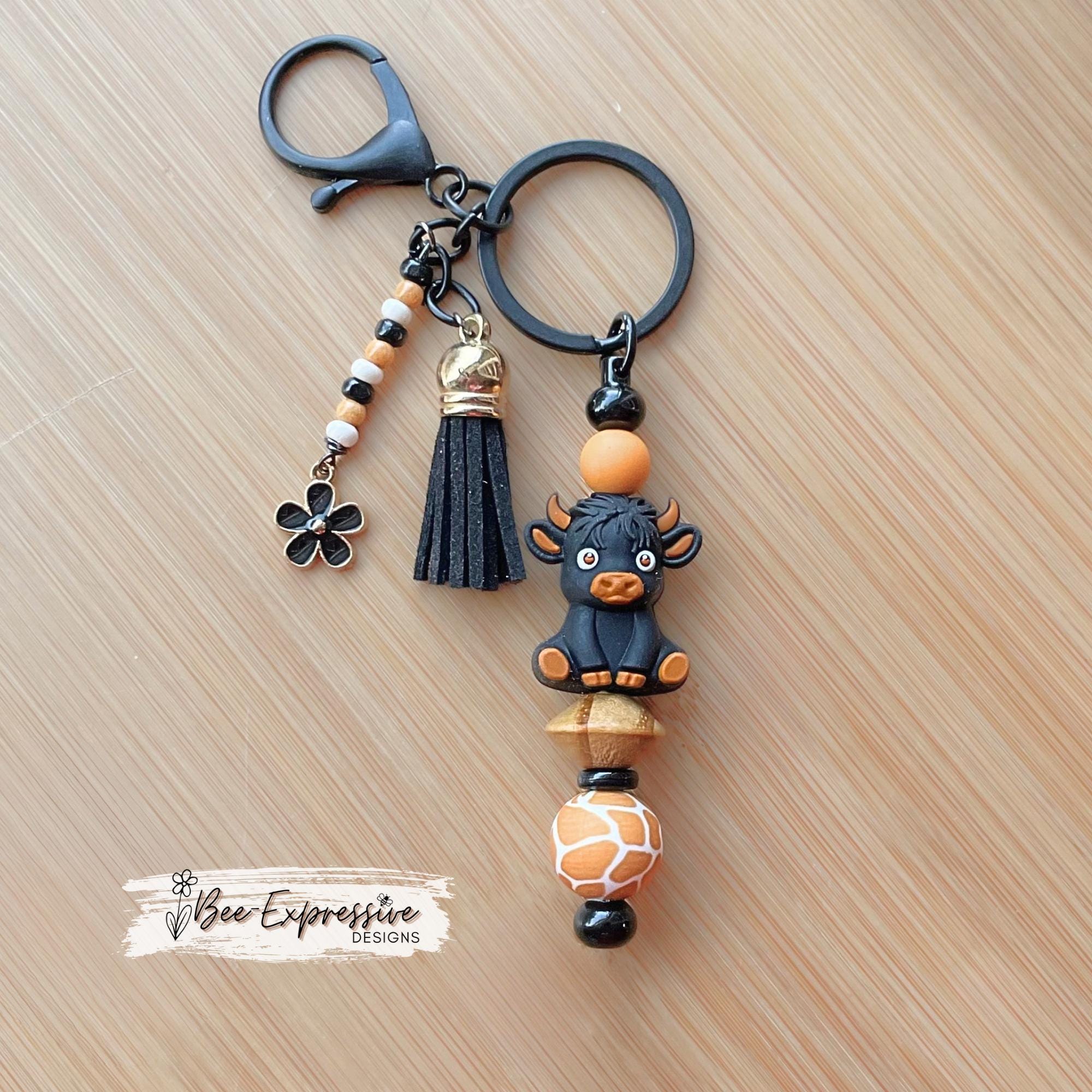 Black 3D COW, BULL, beaded keychain! Lobster clasp, bead bar, animal print bead, silicone beads, beaded tassel with black daisy charm!