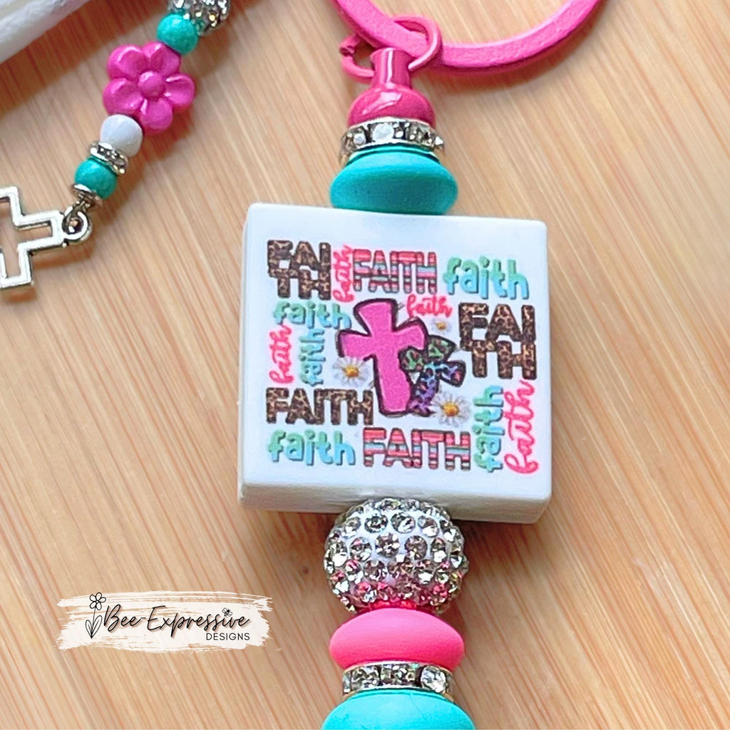 Handmade, FAITH beaded keychain! Lobster clasp, silicone beads, rhinestone spacers, beaded tassel with flowers and a tiny metal cross charm!