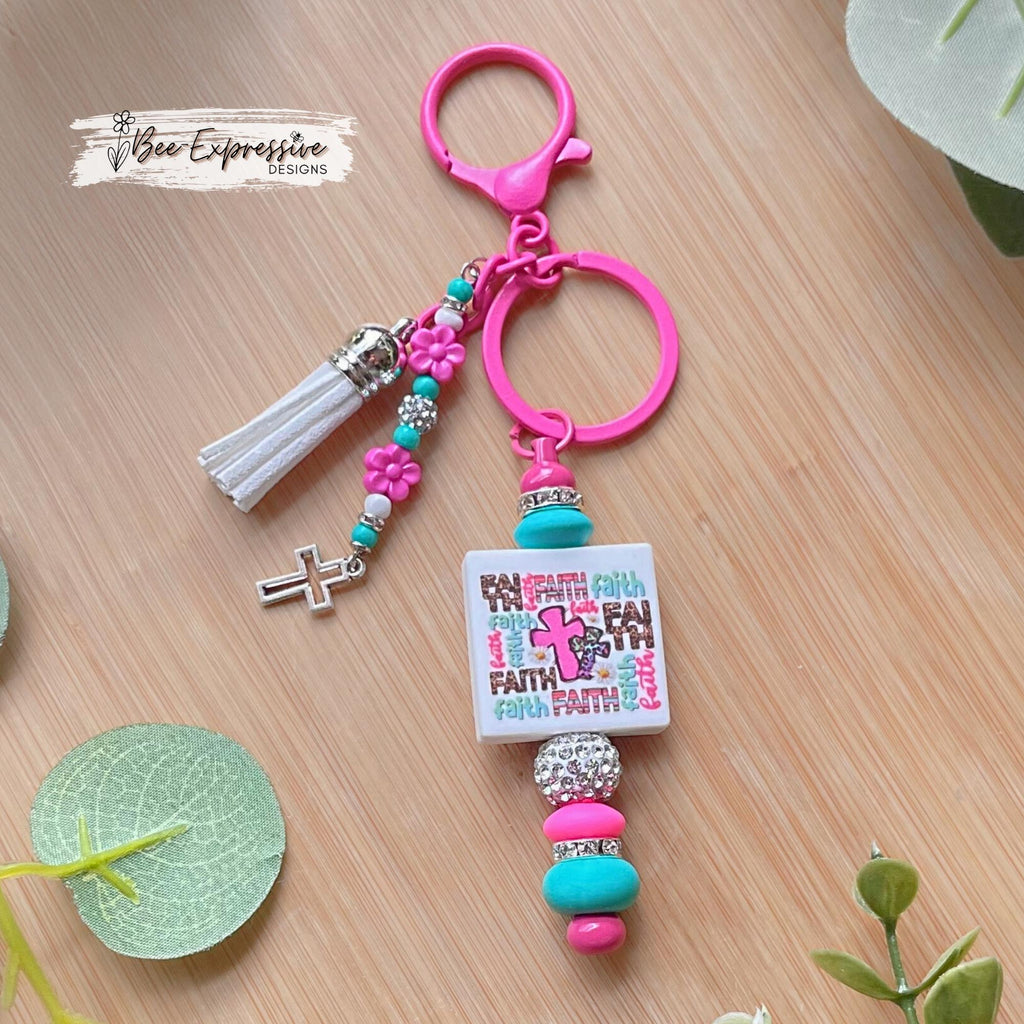 Handmade, FAITH beaded keychain! Lobster clasp, silicone beads, rhinestone spacers, beaded tassel with flowers and a tiny metal cross charm!