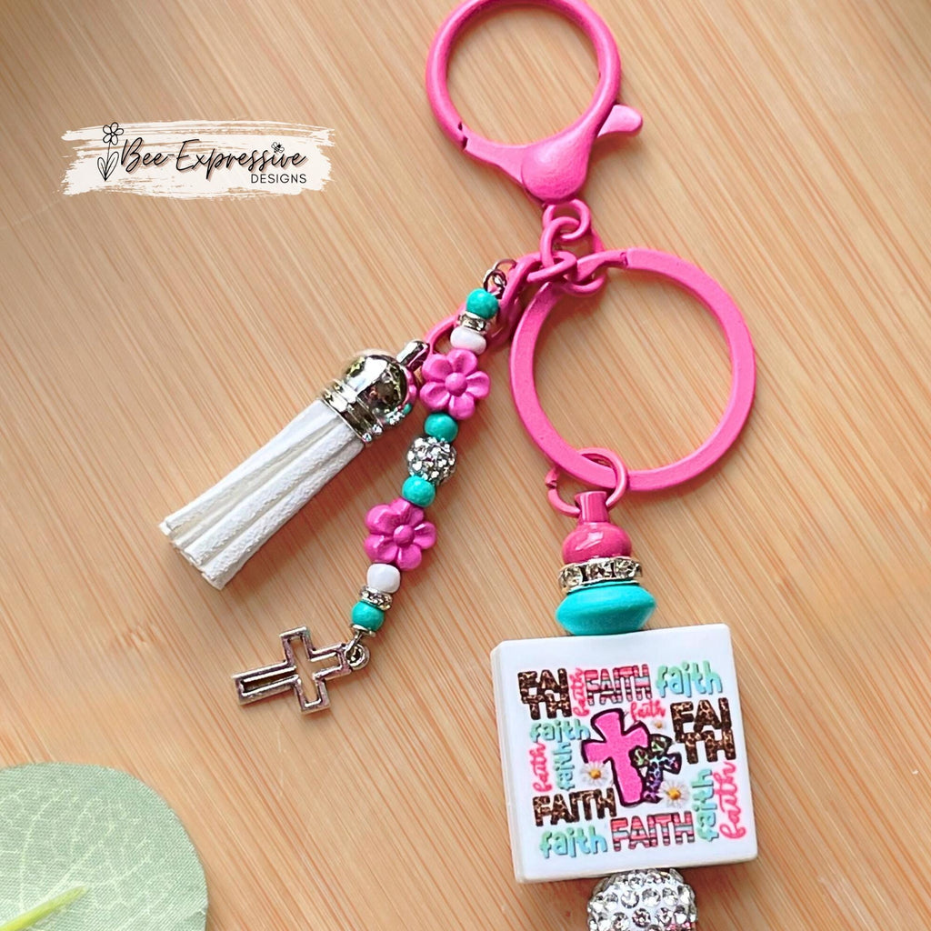 Handmade, FAITH beaded keychain! Lobster clasp, silicone beads, rhinestone spacers, beaded tassel with flowers and a tiny metal cross charm!